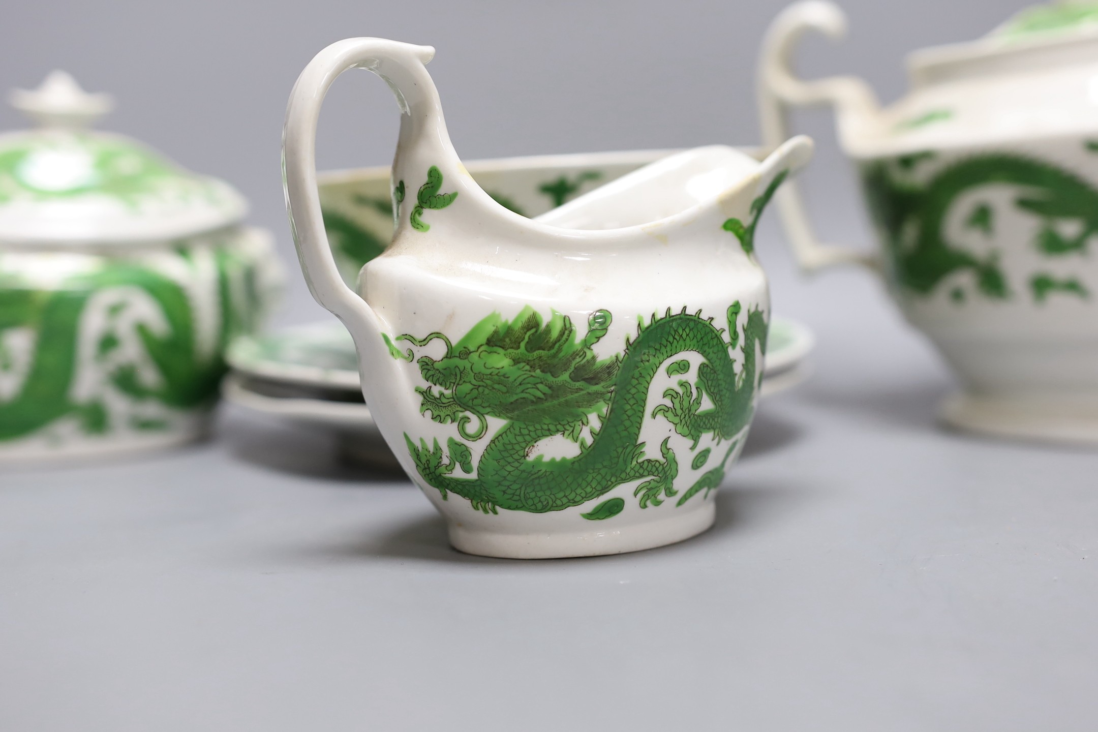 An English porcelain green dragon design part teaset, c.1820, teapot 18 cms high